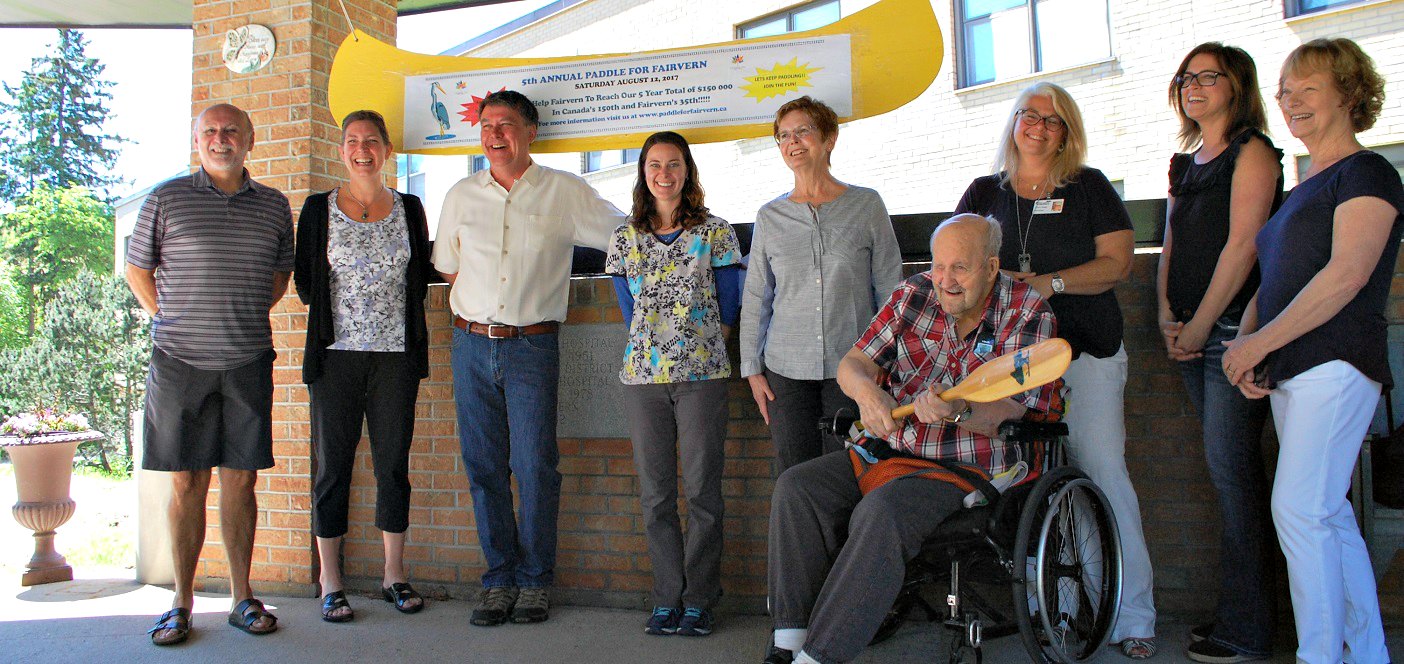 (From left) Bev MacWilliams, Tracey Kuusk, Rob Laver, Sarah Robertson-Smith, Mary Edmonstone, resident Cliff Miller, Tracy Badger, Tanya Blain, and Jan Clark.