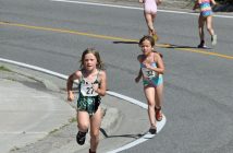 Chloe Forth (left, bib 23) and Ella Willmott (bib 32) head for the finish line and 2nd and 3rd place finishes