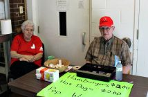 Bernice Greenfield and Bill Guppy sell tickets for the Legion barbecue (Photo: Grant Gibbs)