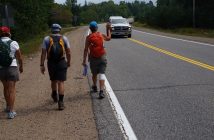 Beth Ward waves to a passing motorist during YWalk
