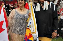 Debra Stanger and Doug Pawis proudly wear their First Nations regalia