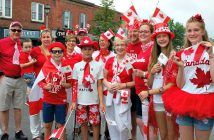 (Back from left) Ray MacCarl, Amy Koteles (holding Ethan), Pat Brown, Bob Brown, Jane Gibson, Jeremy Gordensky, Michelle Gordensky, Claire Koteles, Carleigh O'Neill; (front from left) Jacob Koteles, Nick Koteles, and Gail MacCarl show off their Canada Day spirit