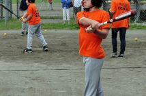 A Dr. Schickler Twin warms up while waiting for a turn at the plate