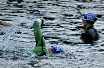 Purple Hospice Huntsville swim caps dotted the water