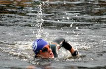 A swimmer heads back to shore for a snack