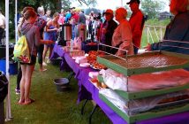 Friendly volunteers provide breakfast for hungry swimmers