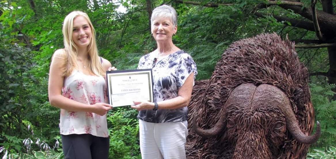 Emma Sultmanis receiving the Elene J. Freer award from Wendie Donabie, President for Muskoka Arts & Crafts (Photo: Muskoka Arts & Crafts)