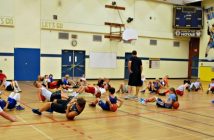 Players do some mid-day stretching at the Hurricanes summer camp