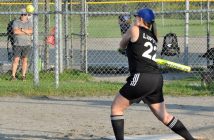 A Keley's batter leans into the hit