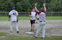 The Kelsey's Crushers celebrate a run against the Knots