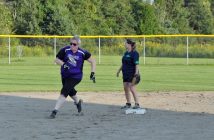 A Nadrofsky Lumber player (purple) rounds the bases