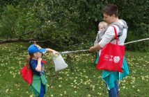 Owyn (with Bronwen holding Shaye) retrieves an apple to take home
