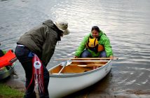 Brenda Noble (left) pulls her team's canoe in. This was the first Paddle For Fairvern for Nikki Bible (back)