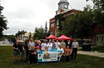 How many volunteers does it take to lay sod on Main Street? This many!