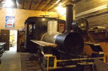 Steam locomotive No. 1 (formerly No. 5) awaits restoration in the storage shed at the Rotary Village Station