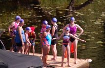 Swim challengers wait at the 1km mark to begin their swim to the Town Docks