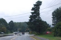 Vehicles had to drive carefully through water across West Road approaching Hanes Road