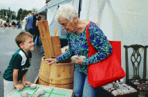 'Grandma Betty' who is not related to five-year-old Cooper Lawrie plays a game of tic-tac-toe.