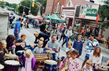 The drum circle is a hit among passersby.