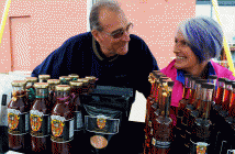 Michele Trottier and her husband Robert Lepage of Maple Bluff Farm share a sweet smile - almost as sweet as the maple products they were selling.