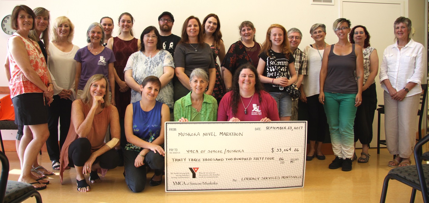 Some of the writers and volunteers for the 2017 Muskoka Novel Marathon present a cheque to YMCA Simcoe/Muskoka for literacy programs in Huntsville
