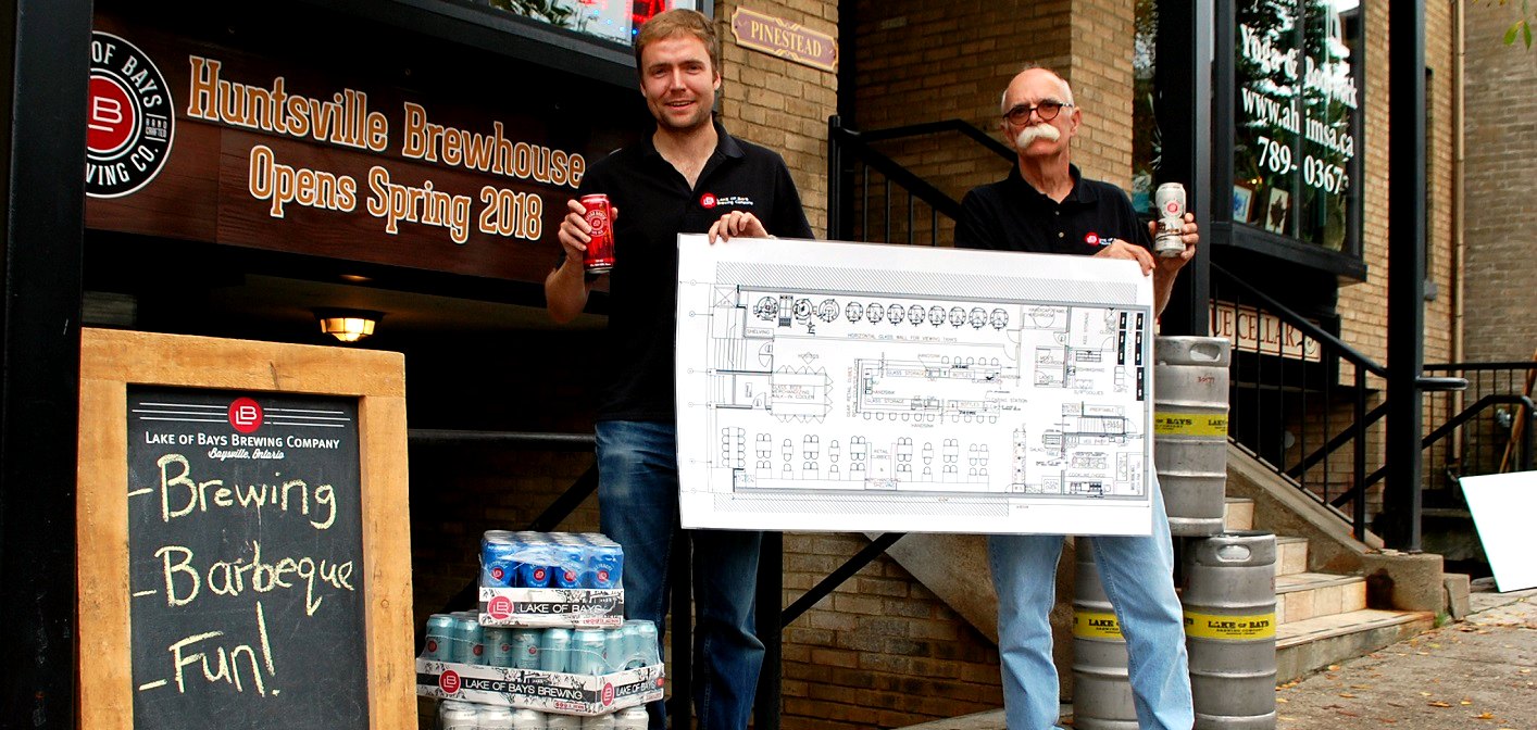 Lake of Bays Brewing Company president Darren Smith and brewmaster Dan Unkerskov with plans for the Huntsville Brewhouse on Main Street