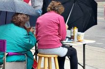 Wendy Moses and Pat Whittle paint in the rain