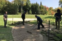 Keith supervises a crew repairing an irrigation problem on hole 11
