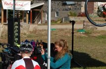 Carlee Wood from Algonquin Outfitters helped cyclists with last minute adjustments to their bikes