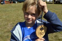 Archer Clayton shows off the handmade souvenir he got from Don Lupton.