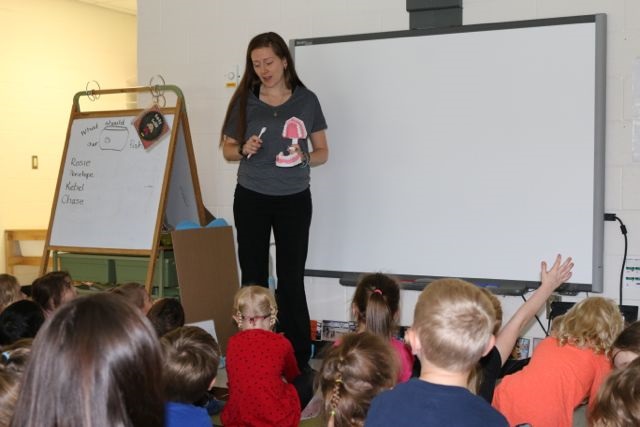 Dental hygienist Dezarae Aldridge-Earl tells Pine Glen kindergarten students why oral health is so important (supplied photo)