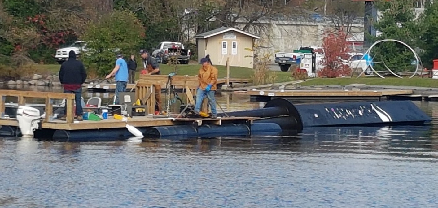 A Pipefusion crew works to remove Pipe Man from the Muskoka River on October 26