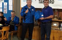 Co-chair of the organizing committee, Eric Spinks, presents a jacket to Rene Landry of Kimberly-Clark