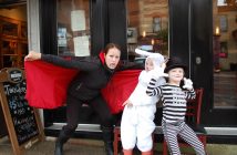(From left) Jennifer Gilroy, Sophie Mann and Ella Gilroy were handing out candy at The Mill on Main