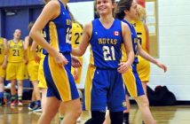 Gabby Arsenault (right) flashes a smile at team captain Emma McAlpine