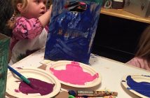 Joni at a meeting making shopping bags out of old cereal boxes (supplied photo)