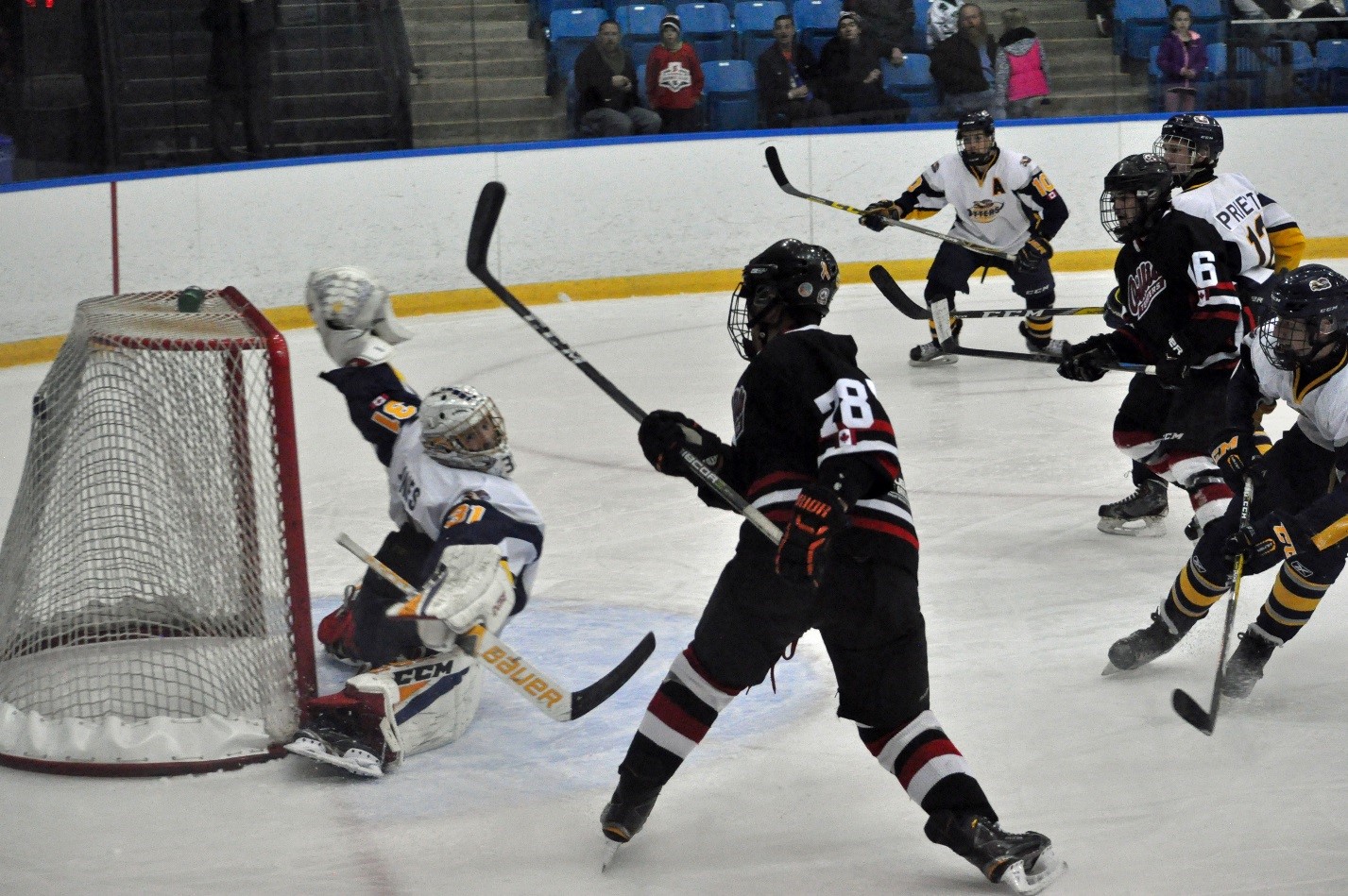 Otters Goalie #31 Mitchell Jones reaches as a Terriers puck finds the back of the net
