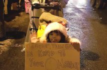 Alesha Breckenridge and her daughter Clare helped make sure that recyclables didn't end up in the trash at the Santa Claus Parade