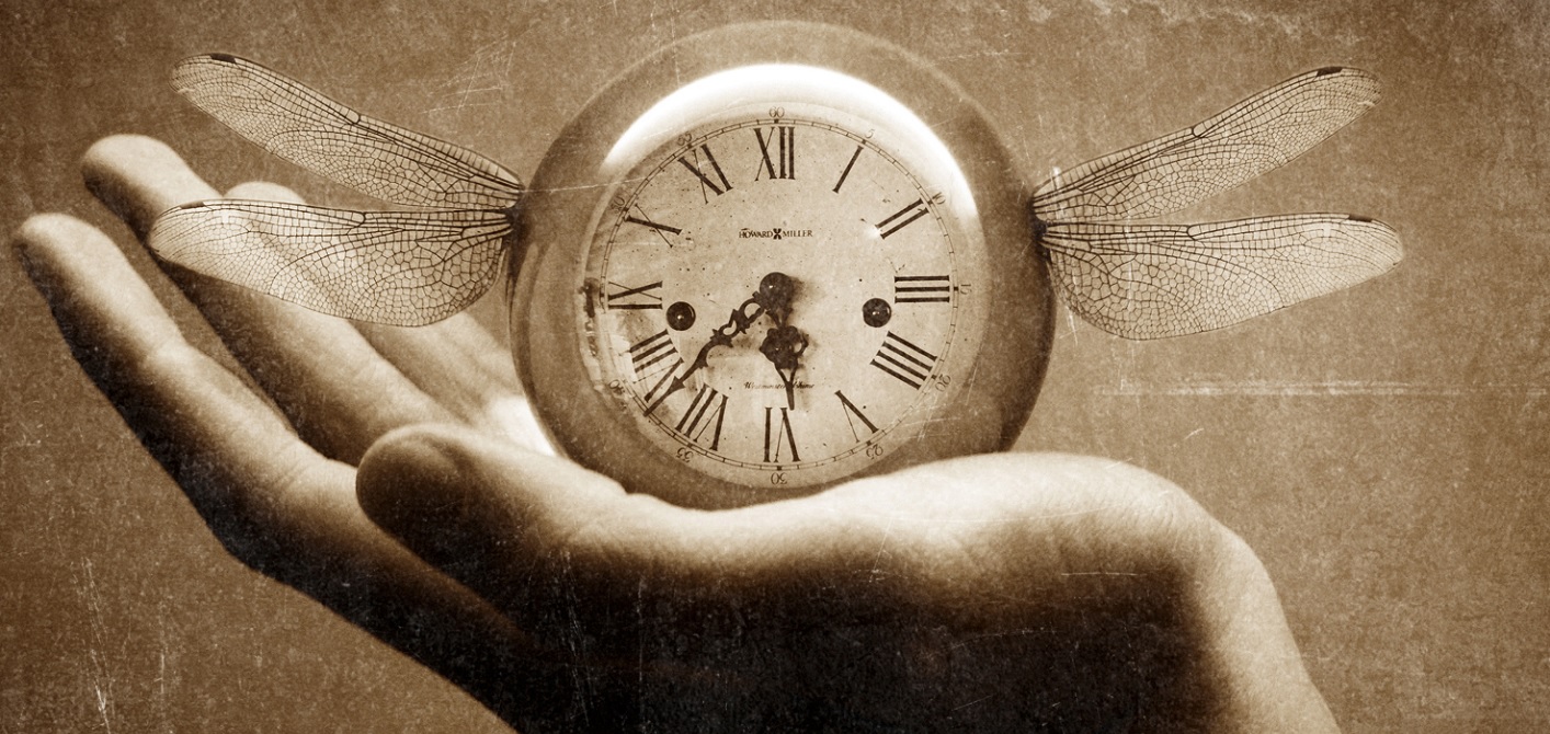 Hand holding clock