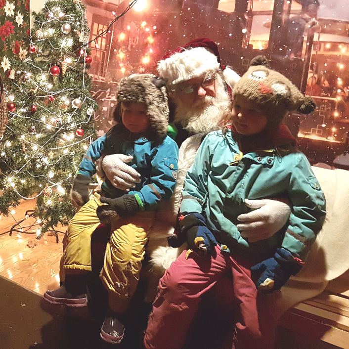 Santa listens intently to wishes so he can add them to his list