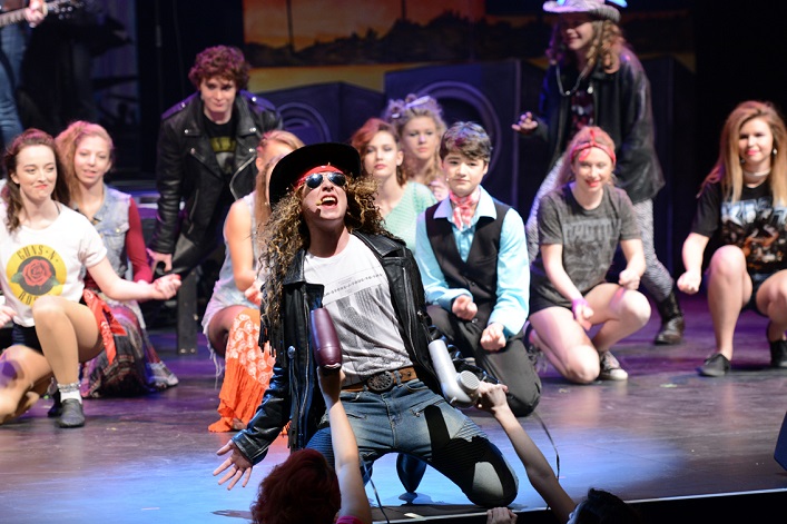 Colin Welsh (foreground) as Stacee Jaxx (Photo: Wilf McQuinn)