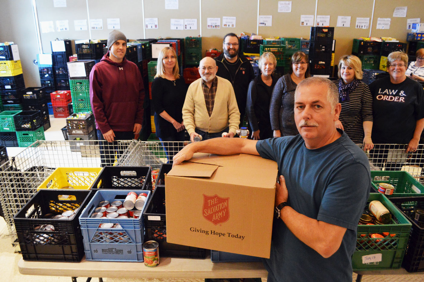 Ralph Gibson (front) leads a team of amazing volunteers who help organize the Salvation Army’s Christmas hampers.