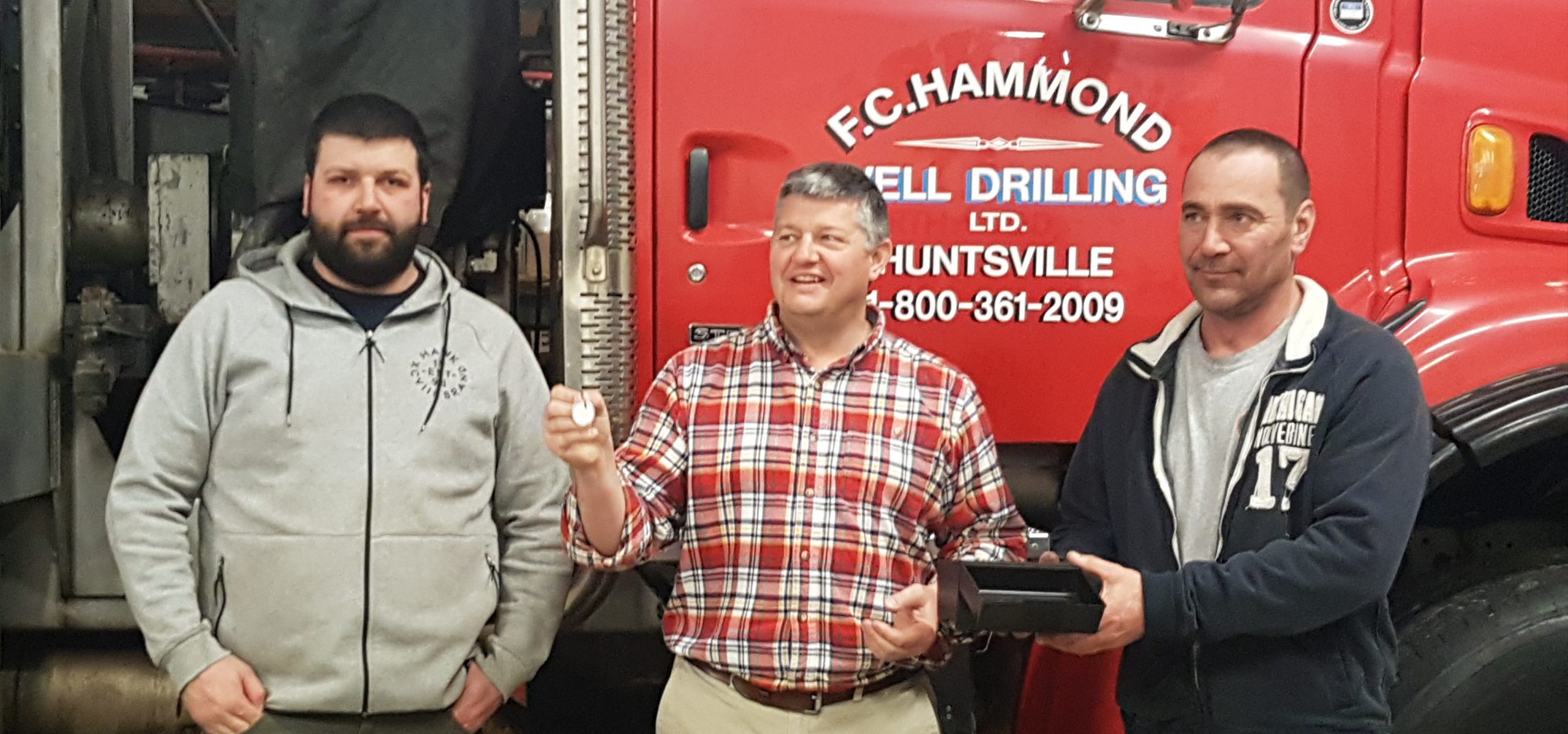 Mayor Scott Aitchison draws the lucky winner with Kyle Cunnington (left) and Jeff Yearley