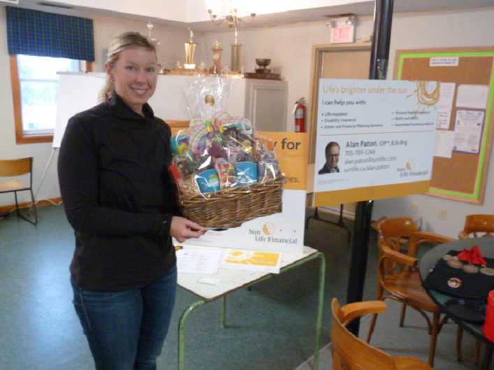 Alana Cork won the delectable gift basket donated by "Nutty Nancy" from Huntsville's Nutty Chocolatier 