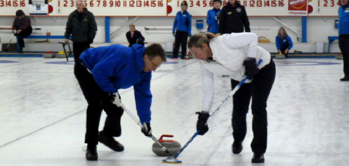 Curlers Mick Parker and Alana Cork ‘hurry hard’ to sweep vice Paul Stueck’s rock into shot position at the Huntsville Curling Club’s Sun Life Financial Mixed Bonspiel securing their second place finish