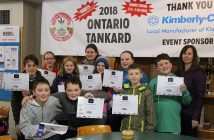 The Huntsville Curling Club's junior curlers show off their Hit, Draw and Tap certificates