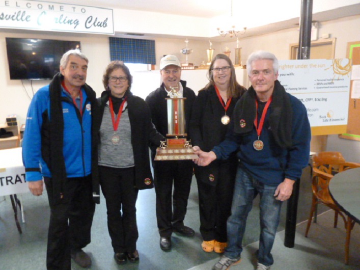 Sun Life Financial sponsor Alan Paton (centre) with the mixed bonspiel championship team (from left) skip Wayne Watkins, lead Mary Ellen Hope, second Cathy Oakden and vice Bruce Stark.