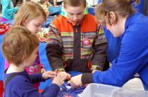 (Clockwise from front left) Clark Winchester, Lily Dove and Izaiah Dove learn all about circuits from Nathalie of Science North