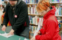 Chris Boyle (left) and Shai Platts-Boyle decorate cookies at Dwight Public Library