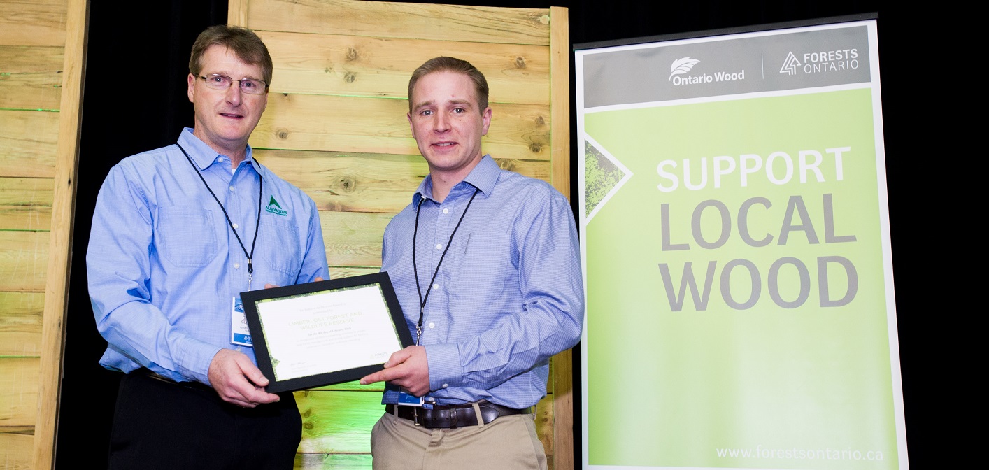Gareth Cockwell (right) receives the award on behalf of Limberlost Forest and Wildlife Reserve from Gord Cummings, Chief Forester at Algonquin Forestry Authority (Photo courtesy of Forests Ontario)